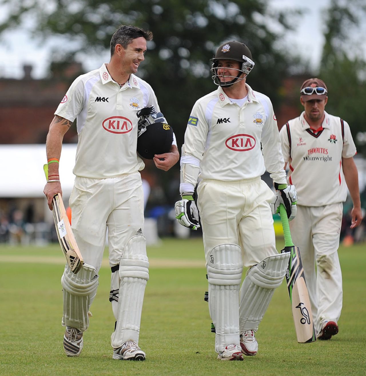 Kevin Pietersen and Steven Davies walk off all smiles, Surrey v Lancashire, County Championship, Division One, 3rd day, Guildford, July 11, 2012