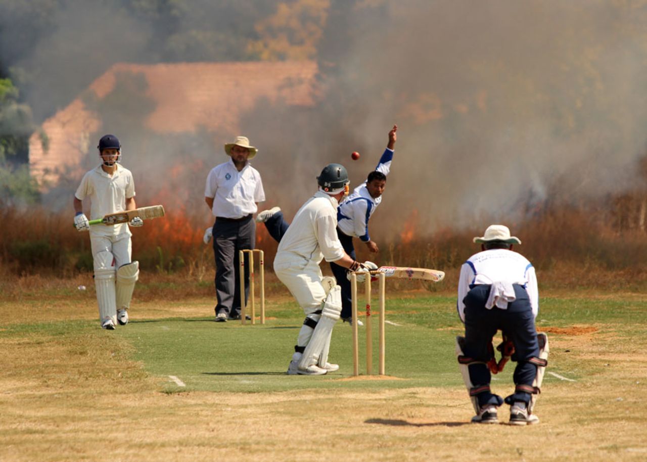 Cricket heats up in Israel - bush fire provides interesting sight screen in match between Lod and Ra'anana 2
