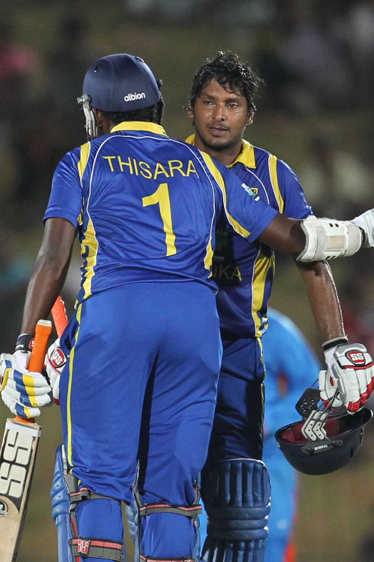 Kumar Sangakkara is congratulated by Thisara Perera after reaching his century, Sri Lanka v India, 1st ODI, Hambantota, July 21, 2012