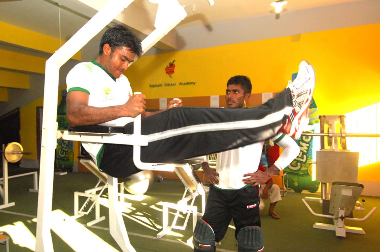 Junaid Siddique (left) and Jahurul Islam work out at the Clemon-Rajshahi Cricket Academy gym, where most of the equipment is made from waste steel materials, 2012