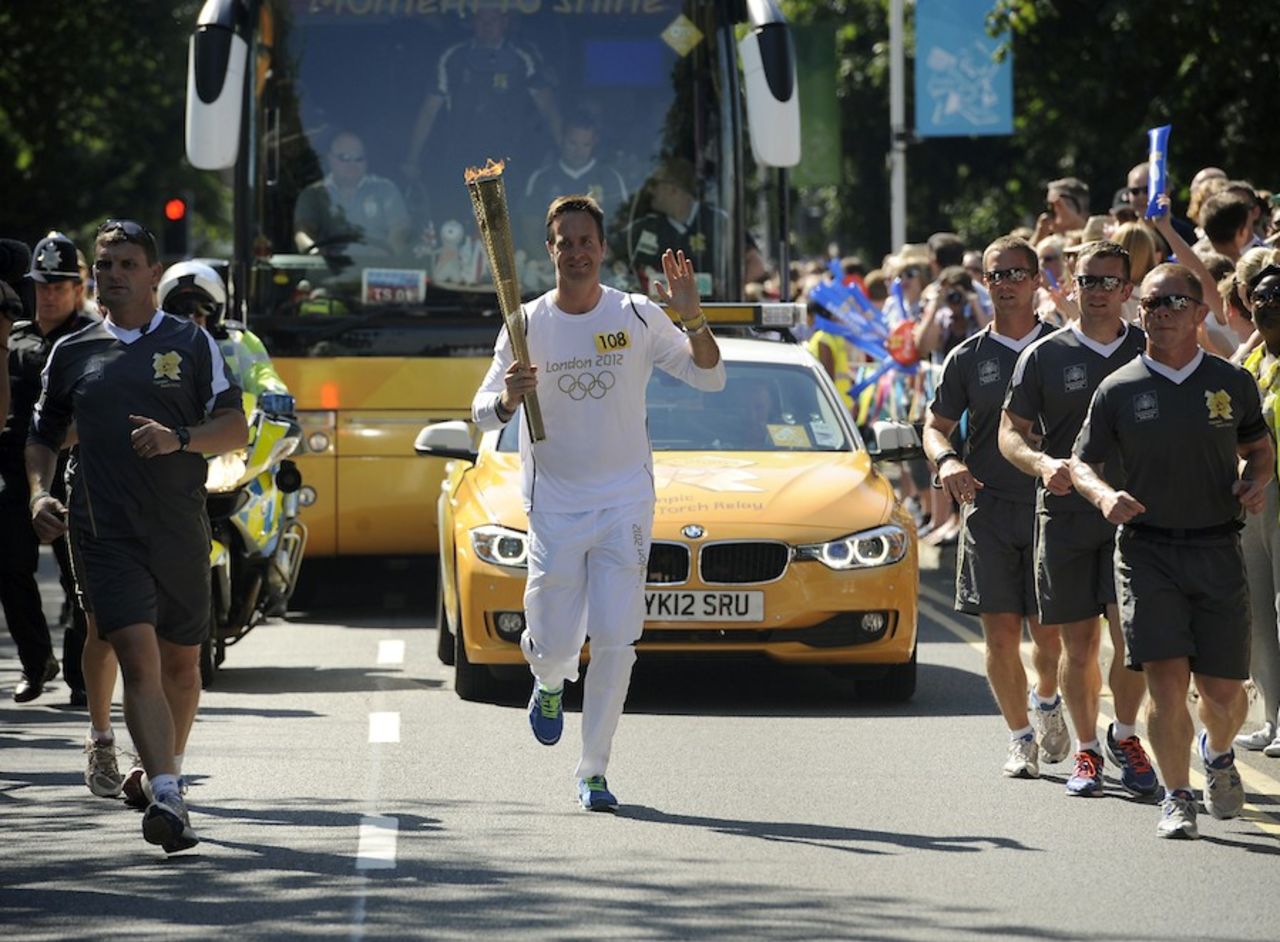 Michael Vaughan runs with the Olympic torch, Hillingdon, England, July 25, 2012