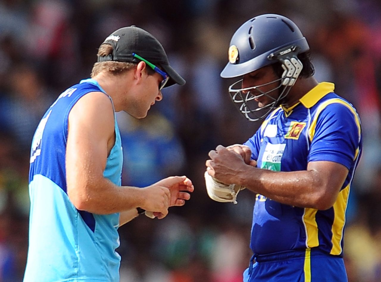 Kumar Sangakkara gets his finger examined by the physiotherapist after being struck by an Ashok Dinda delivery, Sri Lanka v India, 3rd ODI, Colombo, July 28, 2012