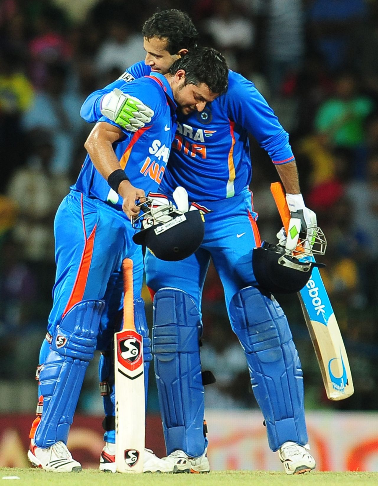 Suresh Raina is congratulated by Irfan Pathan after India's victory off the last over, Sri Lanka v India, 3rd ODI, Colombo, July 28, 2012