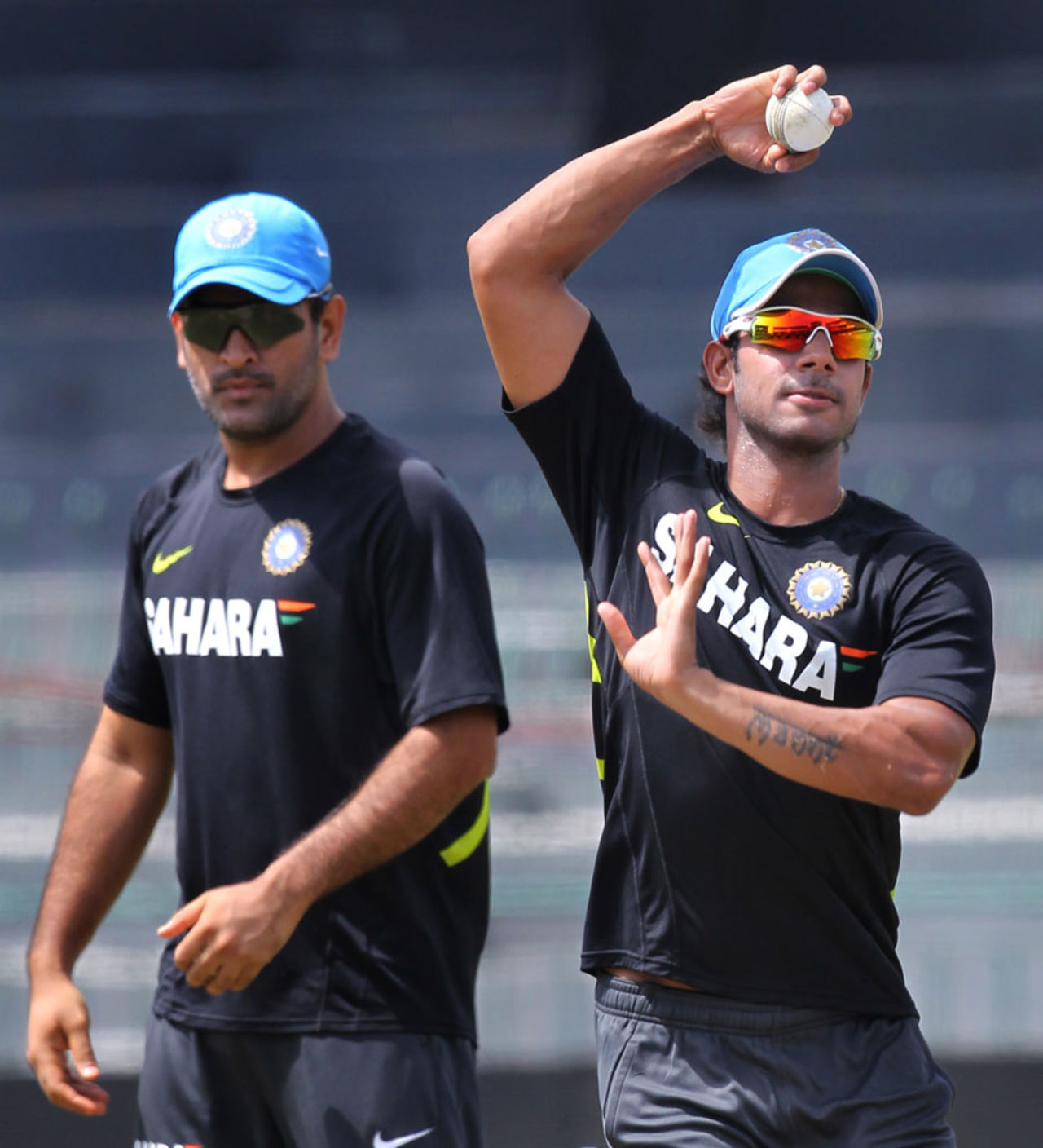 MS Dhoni watches Manoj Tiwary bowl at a training session, Colombo, July 30, 2012