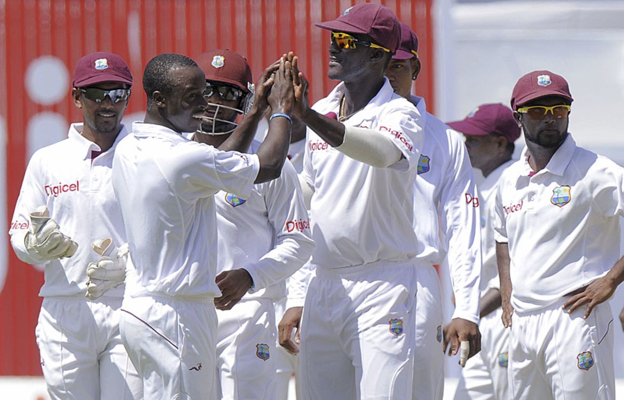 Kemar Roach and his team-mates celebrate an early wicket, West Indies v New Zealand, 2nd Test, Jamaica, 1st day, August 2, 2012