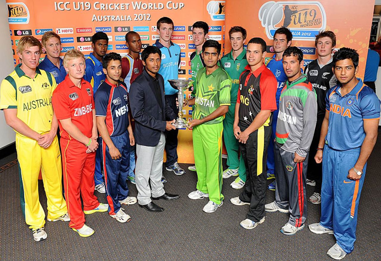 The captains of the 16 Under-19 teams pose with the World Cup trophy, Brisbane, August 6, 2012