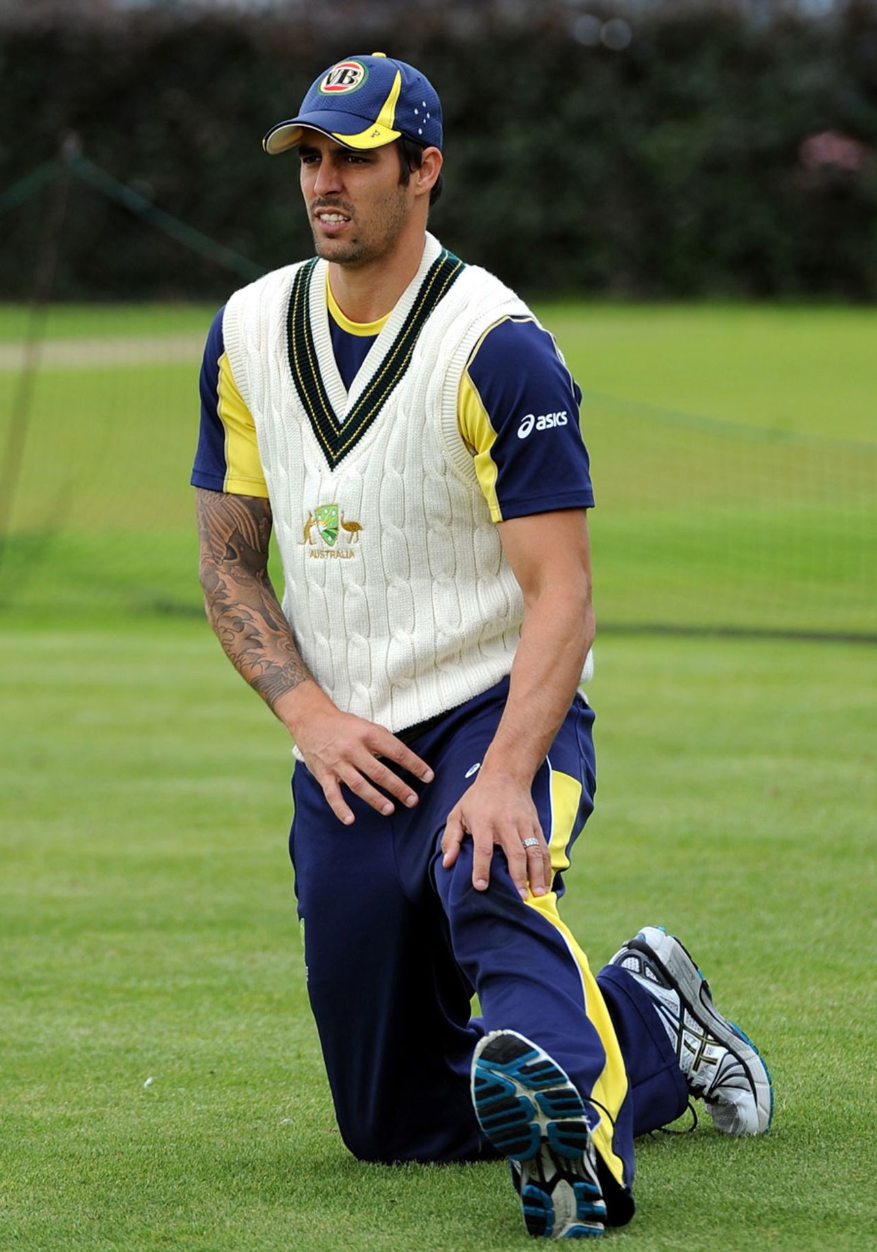 Mitchell Johnson stretches during nets, Old Trafford, August 6, 2012