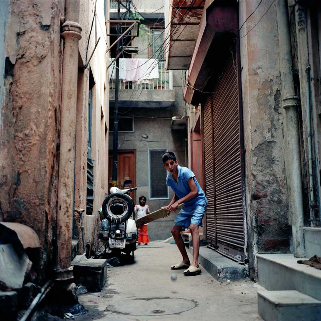 Narrow lanes in-between two apartments is the pitch for the youngsters to play cricket