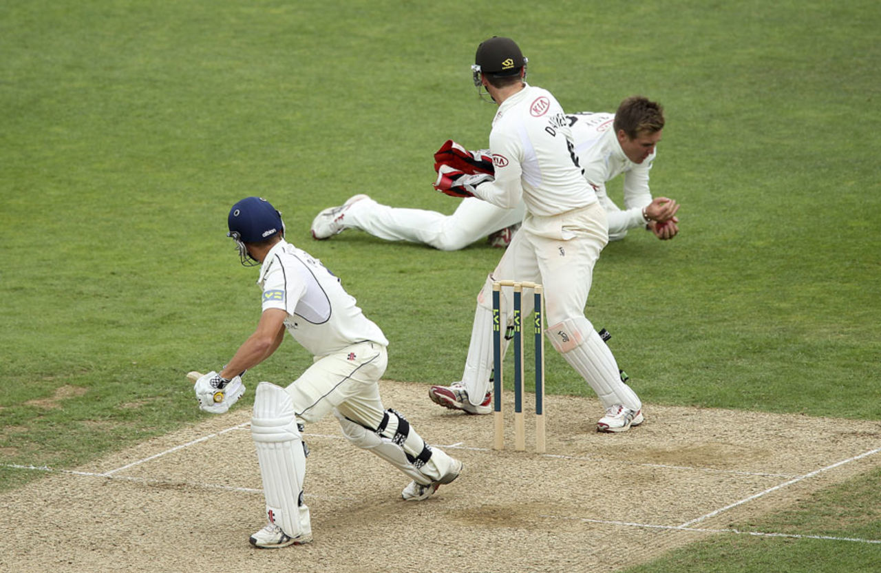 Neil Dexter is held at slip by a diving Jason Roy, Surrey v Middlesex, County Championship, The Oval, 2nd day, August, 26, 2012