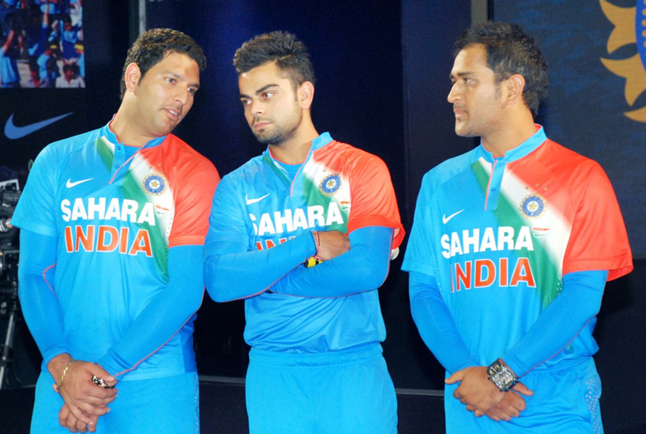 Yuvraj Singh, Virat Kohli and MS Dhoni in the new India jerseys for the World Twenty20, Mumbai, August 16, 2012