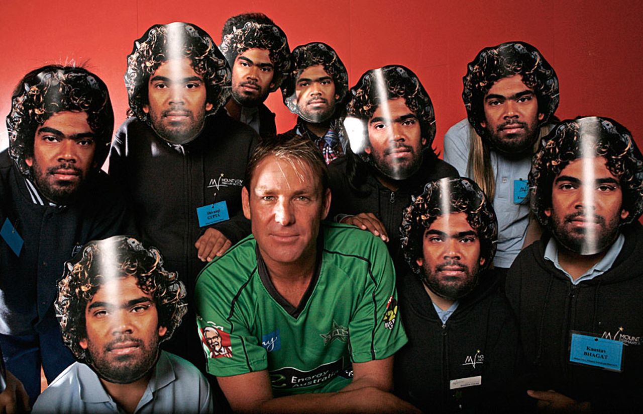 Shane Warne poses with children wearing Lasith Malinga masks after he was named captain of Melbourne Stars, Melbourne, August 21, 2012