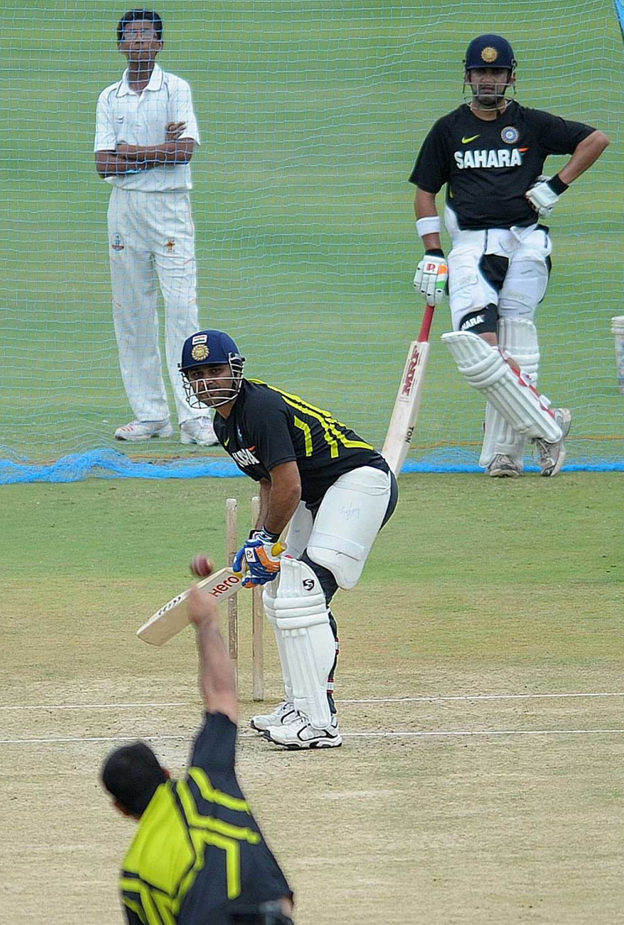 Virender Sehwag bats at the nets as Gautam Gambhir watches on, Hyderabad, August 21, 2012
