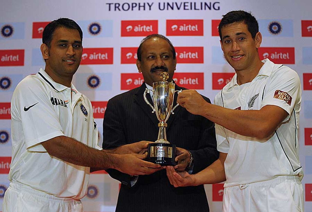MS Dhoni and Ross Taylor pose with the series trophy, Hyderabad, August 21, 2012