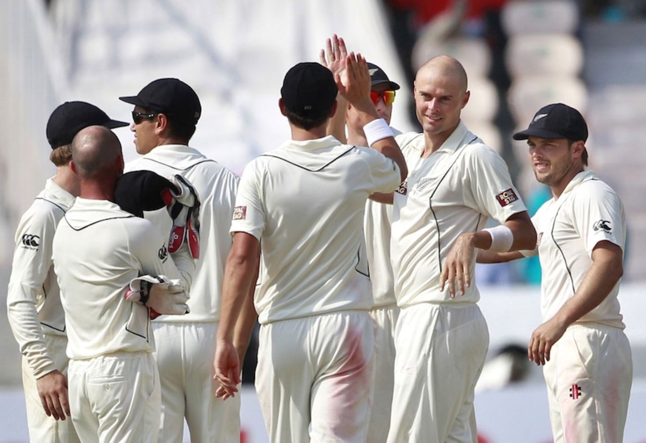 Chris Martin being congratulated by team-mates after picking up Virat Kohli, India v New Zealand, 1st Test, Hyderabad, 1st day, August 23, 2012