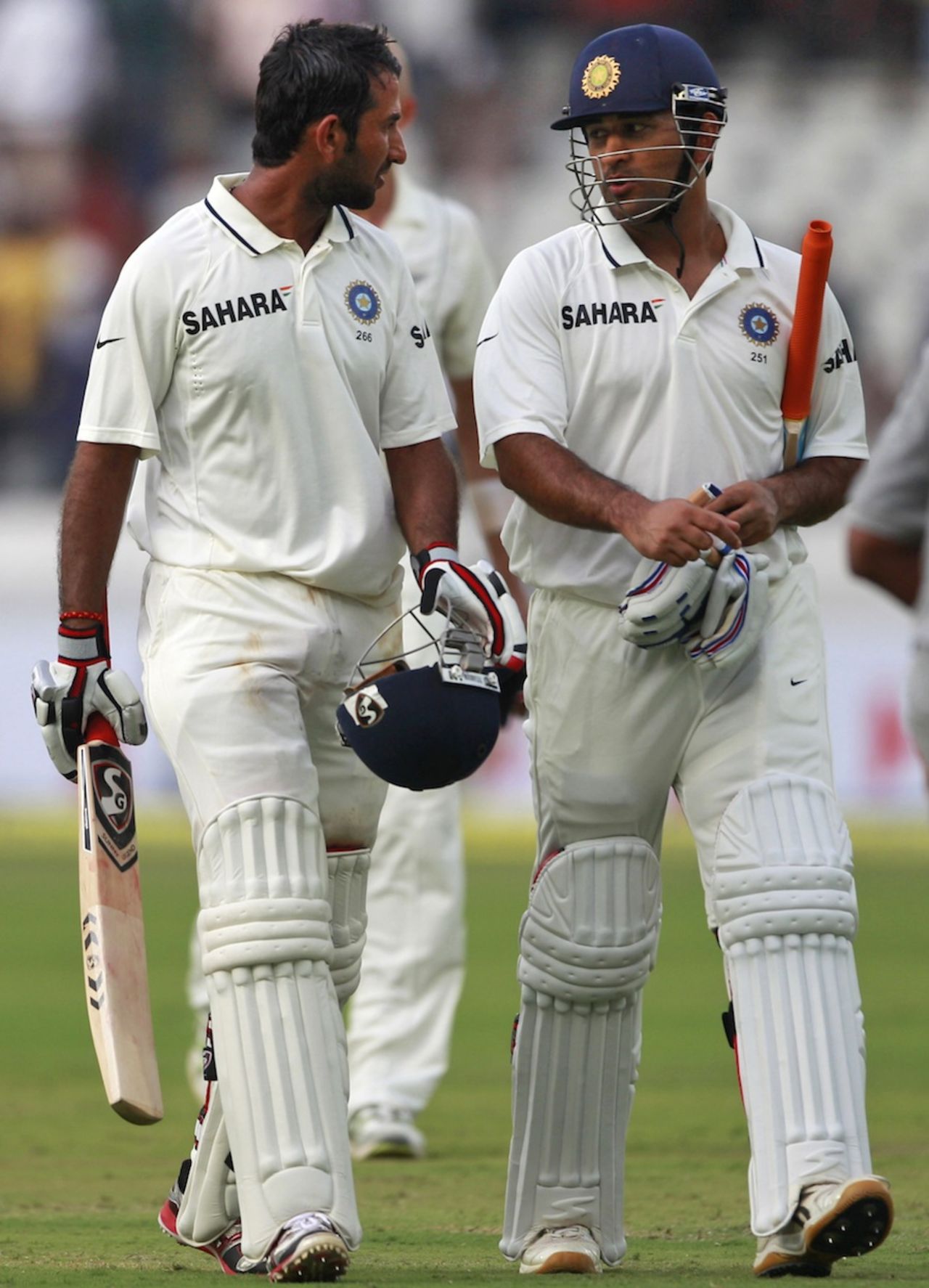 Cheteshwar Pujara and MS Dhoni walk back at the end of day's play, India v New Zealand, 1st Test, Hyderabad, 1st day, August 23, 2012
