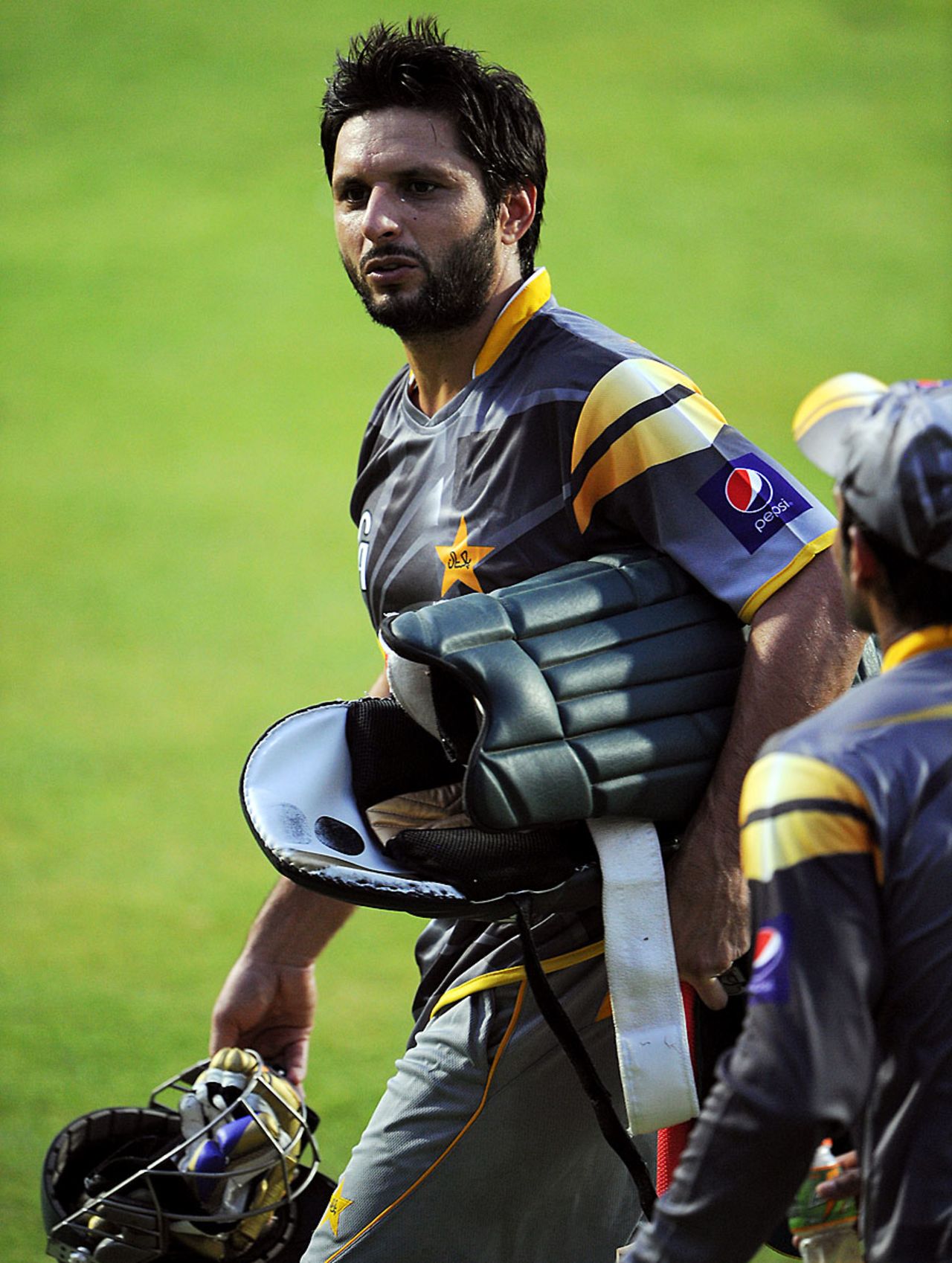 Shahid Afridi walks out for a nets session, Sharjah, August 26, 2012