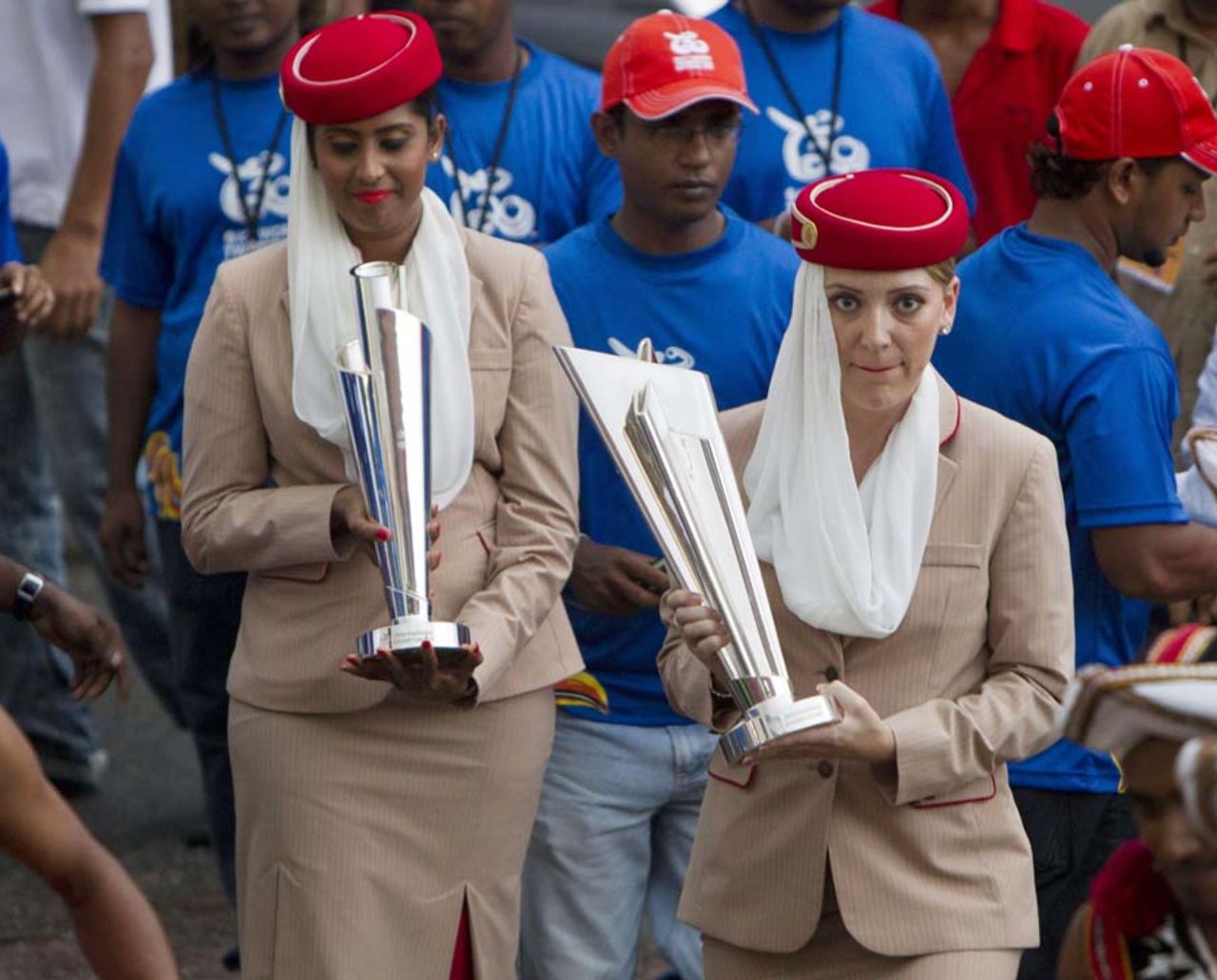 Air hostesses hold the World T20 trophy in a ceremony to hand over the trophy to Sri Lankan sports minister after its arrival from Dubai, Colombo, August 29, 2012