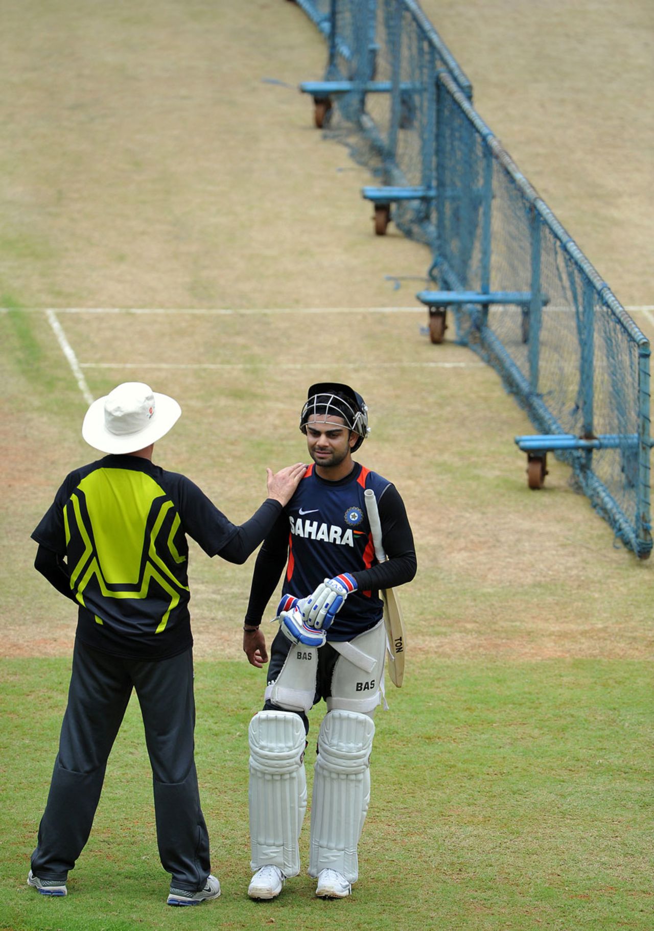 Virat Kohli gets a pat on the shoulder from Duncan Fletcher, Bangalore, August 30, 2012