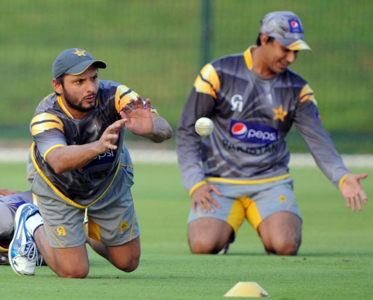 Shahid Afridi takes a catch at a practice session, Abu Dhabi, August 30, 2012