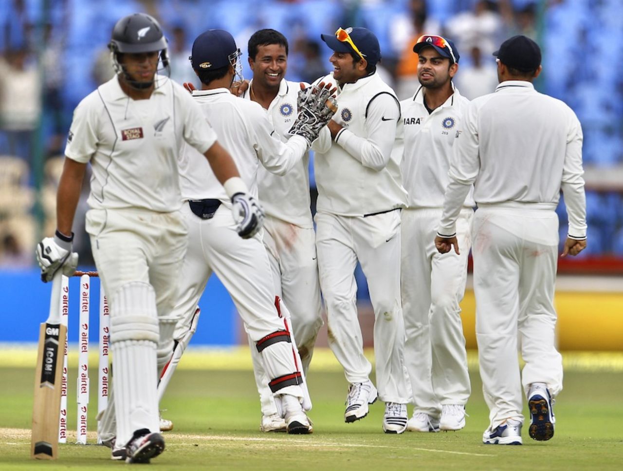 Pragyan Ojha being congratulated by team-mates after he picked up Ross Taylor's wicket, India v New Zealand, 2nd Test, Bangalore, 1st day, August 31, 2012