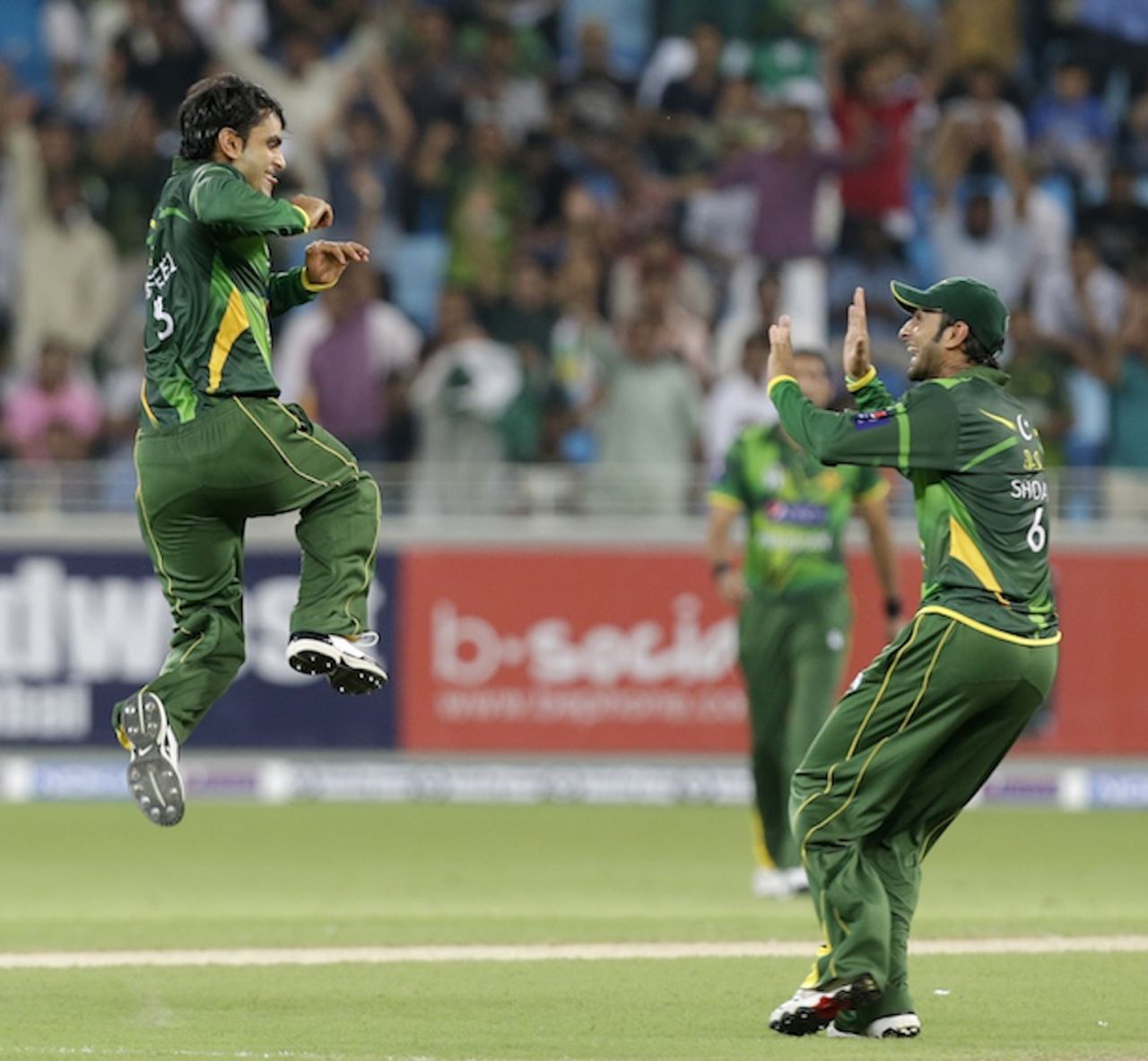 Mohammad Hafeez leaps in the air after picking David Warner's wicket, Pakistan v Australia, 1st T20I, Dubai, September 5, 2012