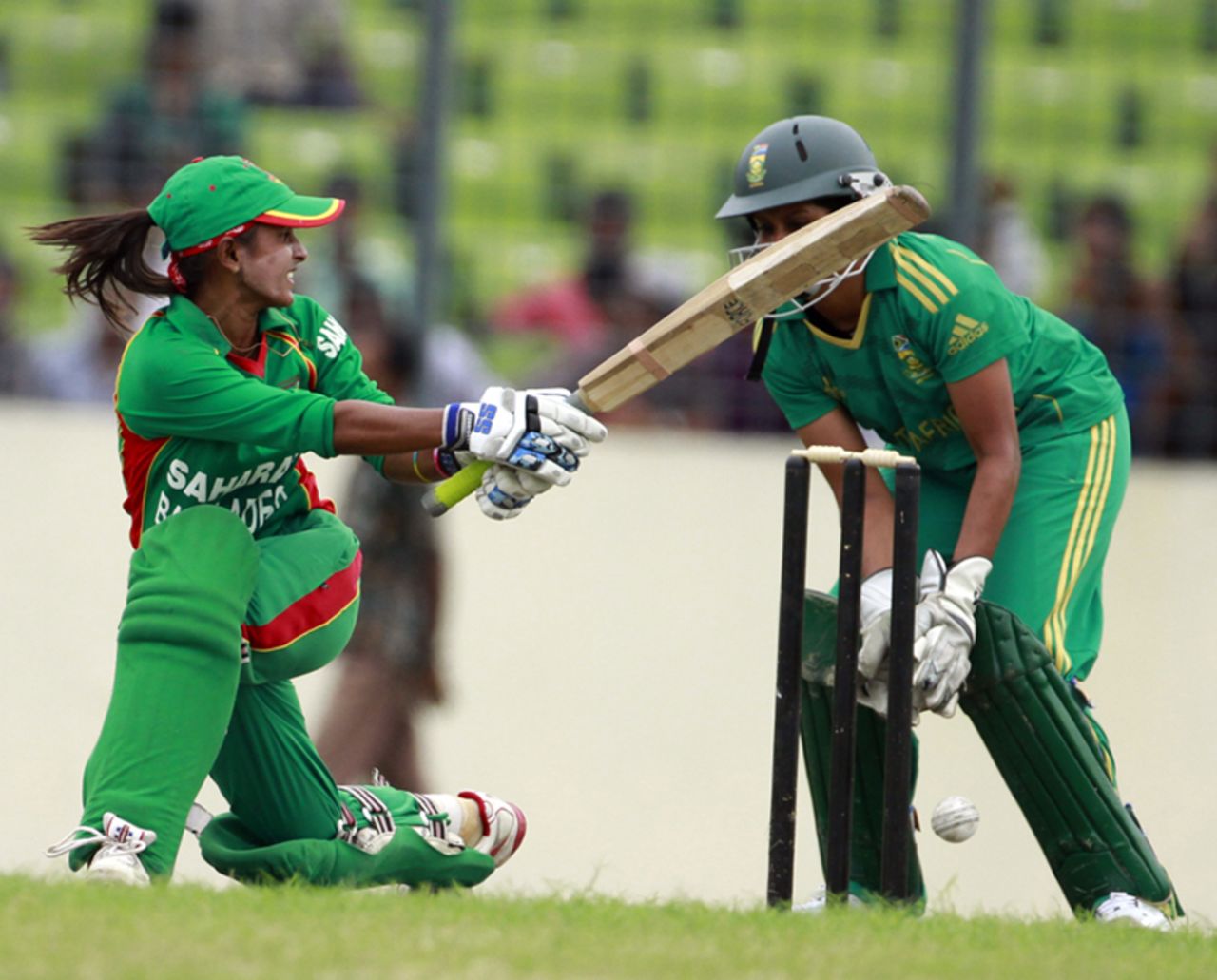 Bangladesh's Lata Mondal plays a sweep shot, Bangladesh Women v South Africa Women, 1st ODI, Dhaka, September 6, 2012