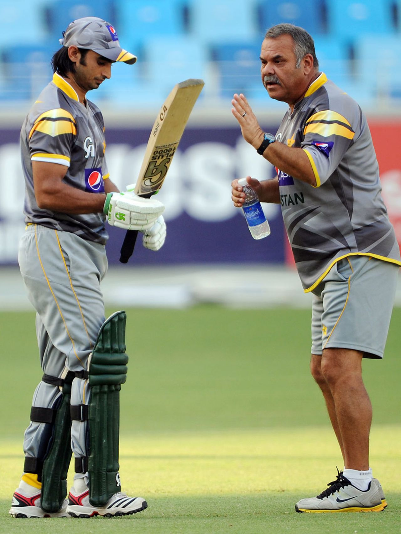 Imran Nazir gets some tips from coach Dav Whatmore at a training session, Dubai, September 8, 2012