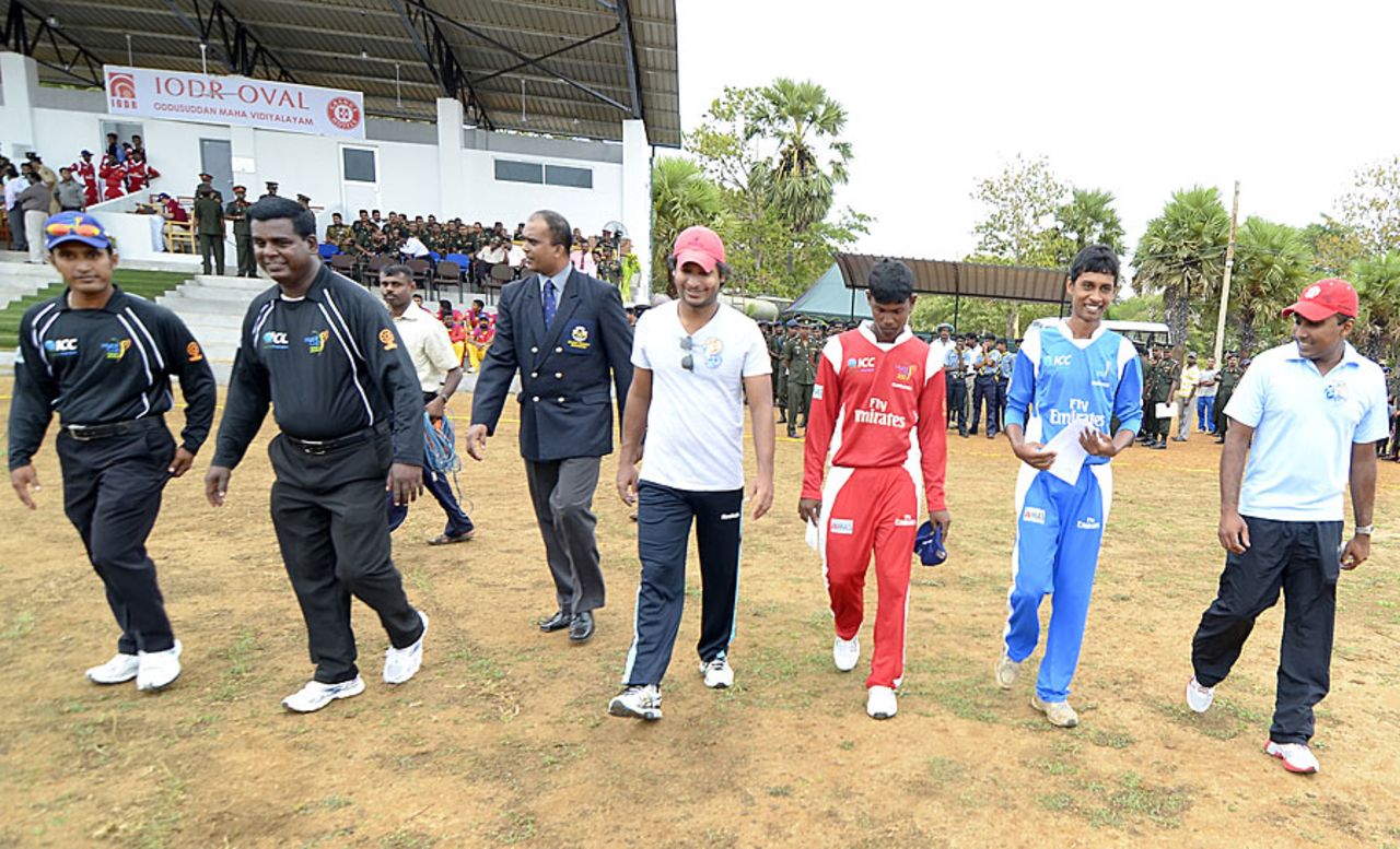 Kumar Sangakkara and Mahela Jayawardene walk out onto the new pitch at Oddusuddan Oval, Mullaitivu, September 8, 2012