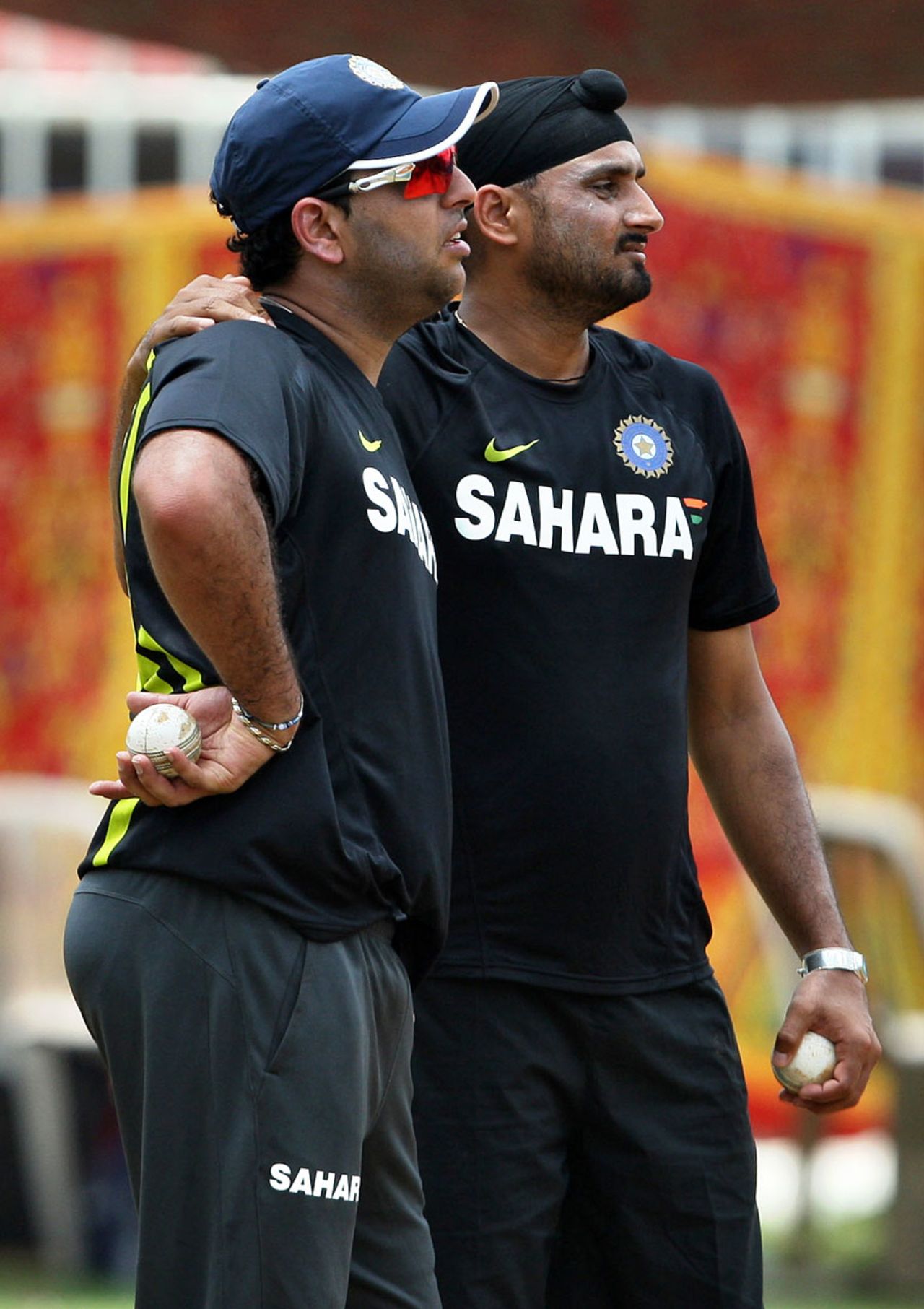 Yuvraj Singh and Harbhajan Singh have a chat at practice, Chennai, September 10, 2012