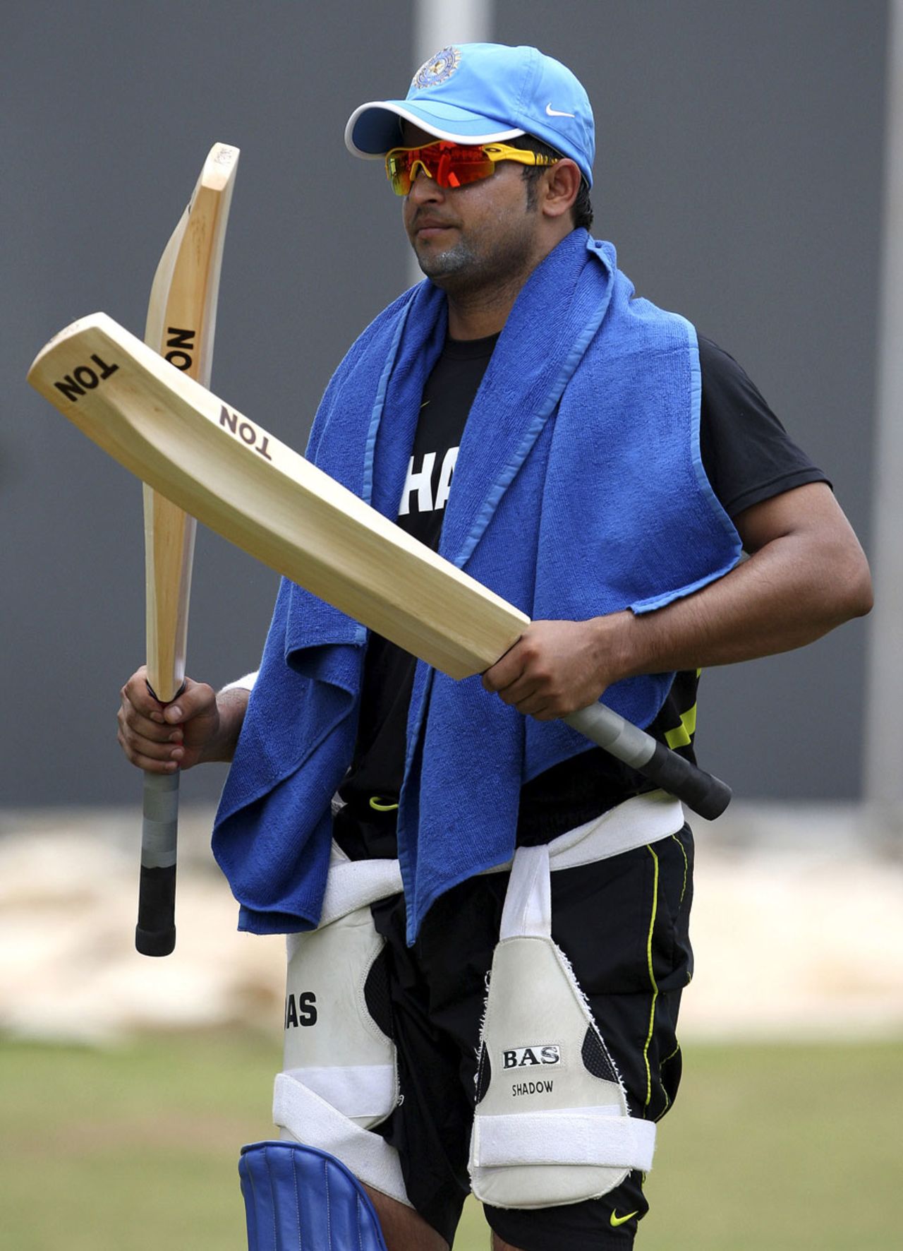 Suresh Raina inspects bats at training, Chennai, September 10, 2012