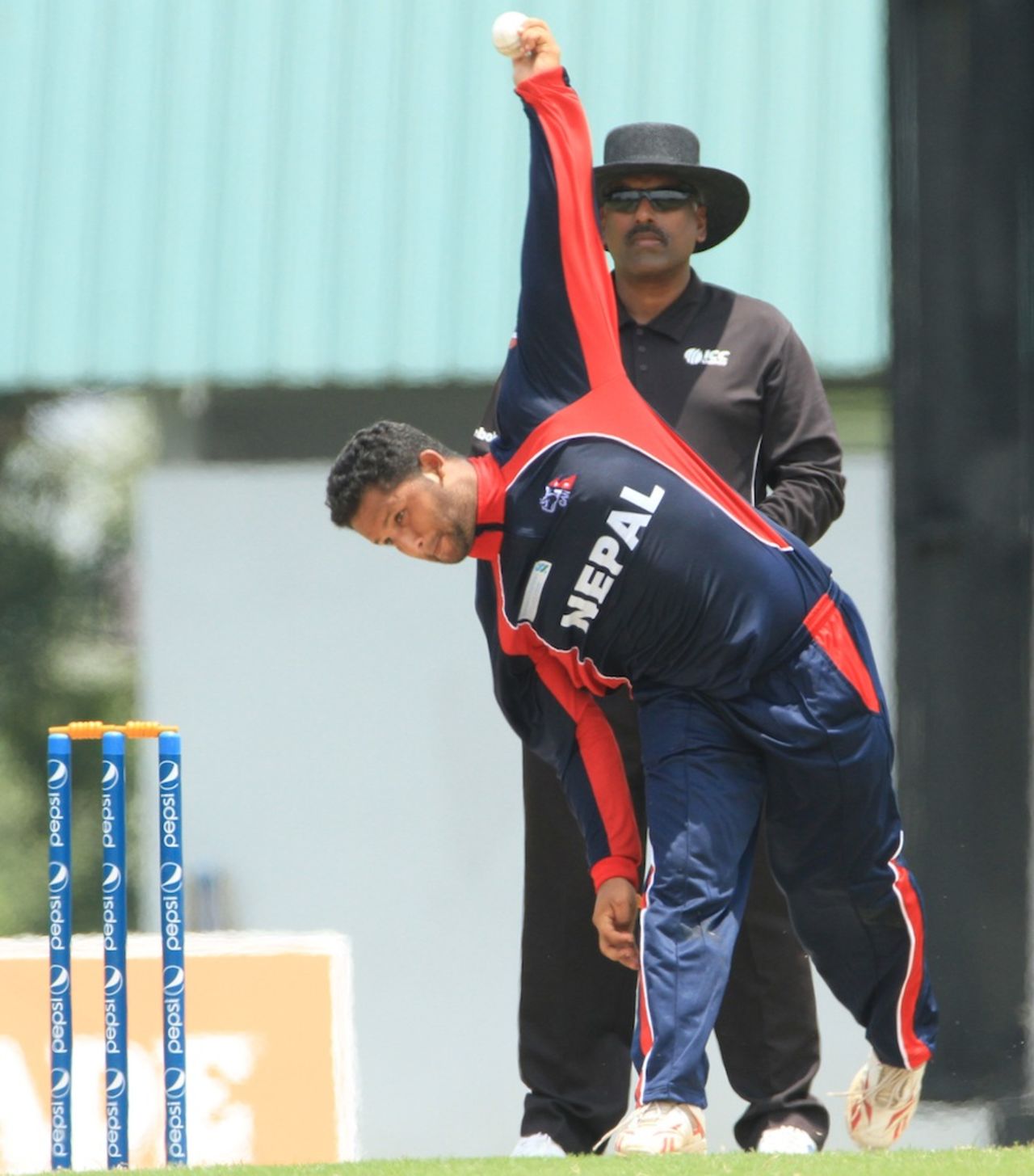 Basanta Regmi bowls during the final, Nepal v USA, ICC World Cricket League Division Four 2012, Kuala Lumpur, September 10, 2012