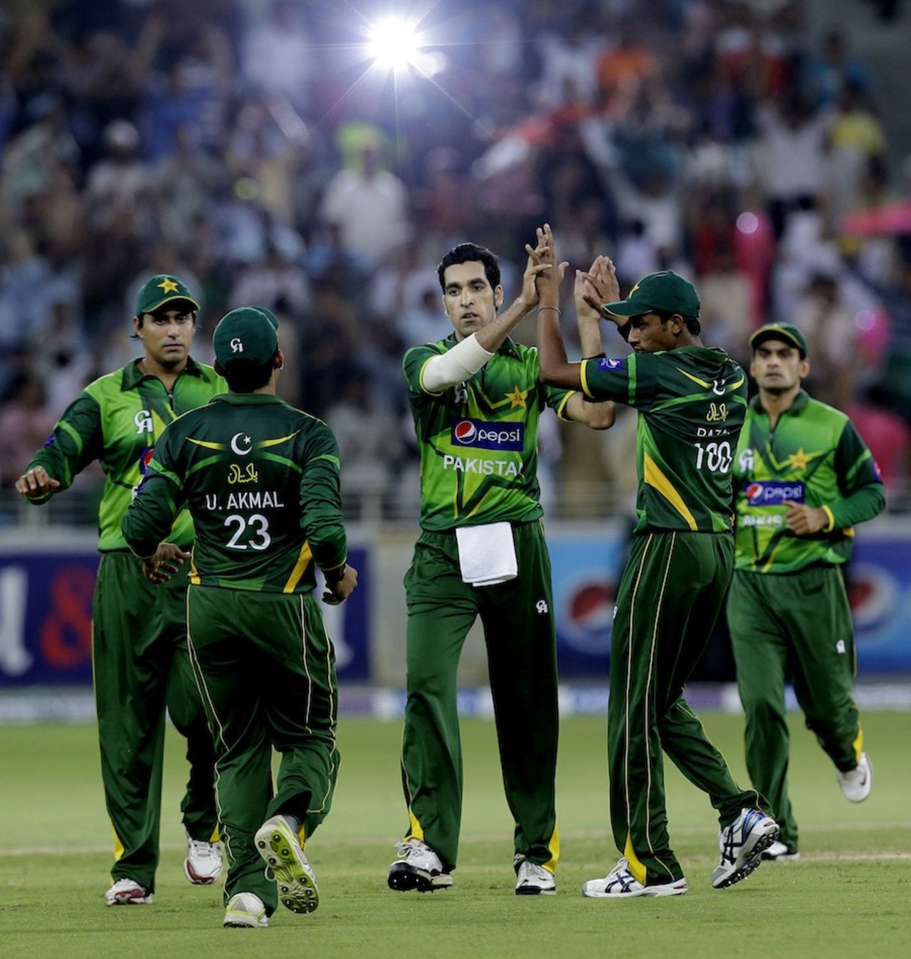 Umar Gul celebrates a wicket with team-mates, Pakistan v Australia, 3rd T20I, Dubai, September 10, 2012