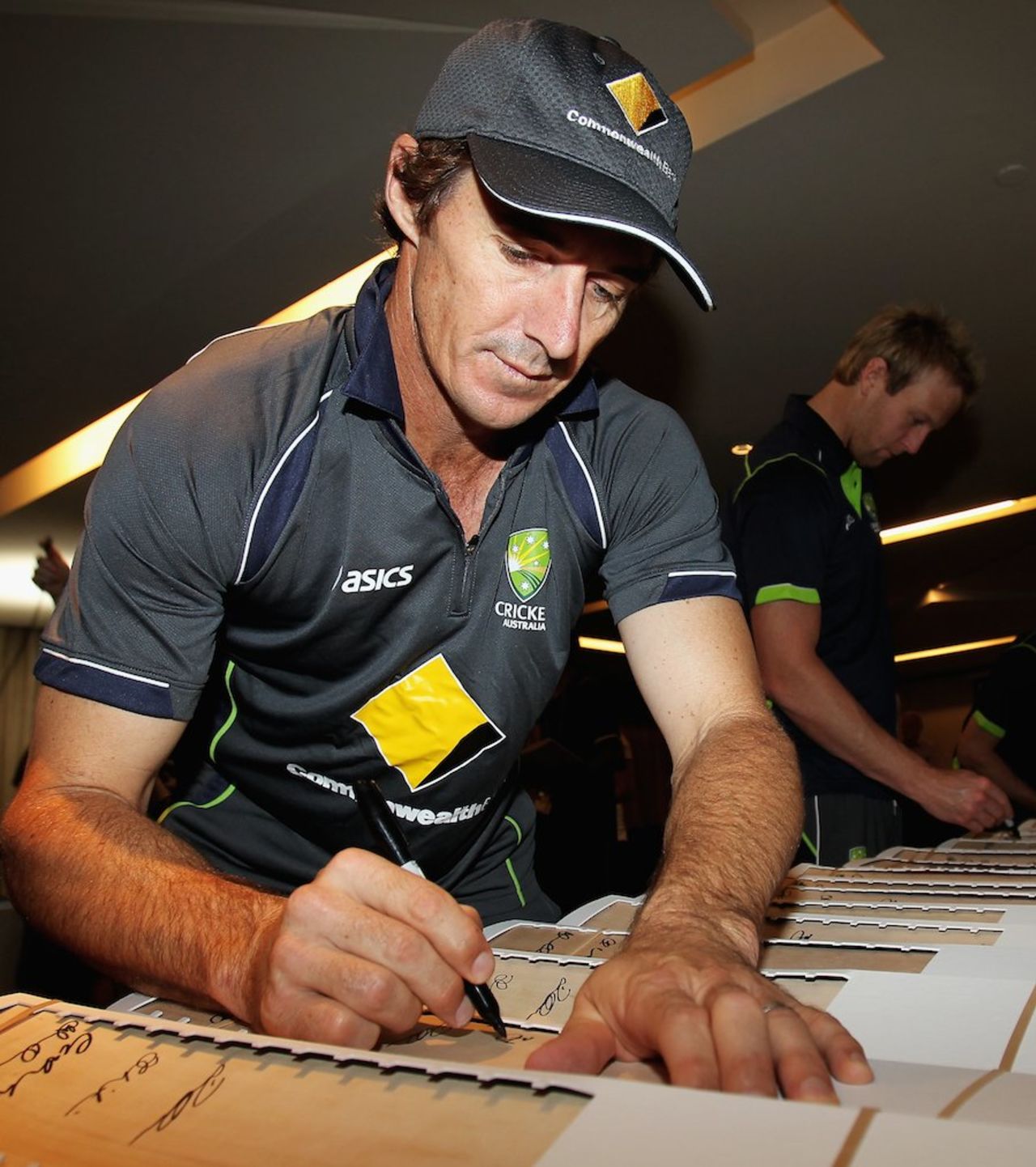 Brad Hogg signs bats, World Twenty20 2012, Colombo, September 13, 2012