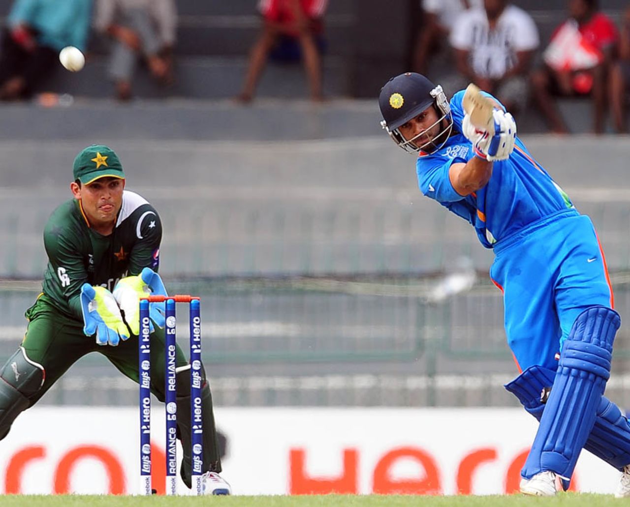Virat Kohli steps down the track to loft a ball, India v Pakistan, World Twenty20 warm-ups, Colombo, September 17, 2012