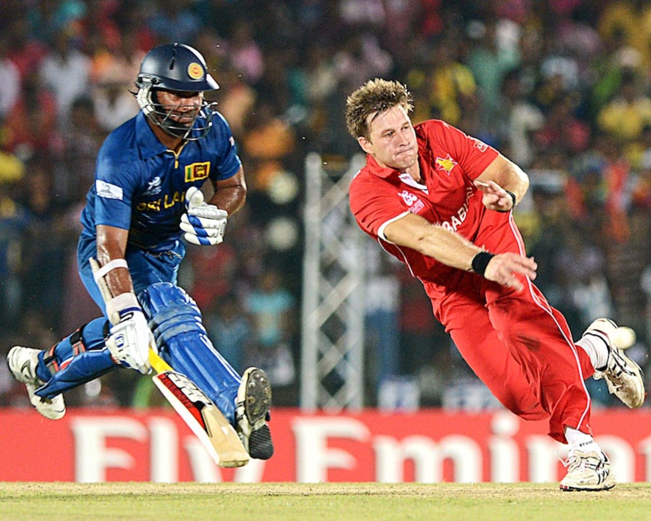 Kyle Jarvis attempts a run-out against Kumar Sangakkara, Sri Lanka v Zimbabwe, Group C, World T20 2012, Hambantota, September 18, 2012