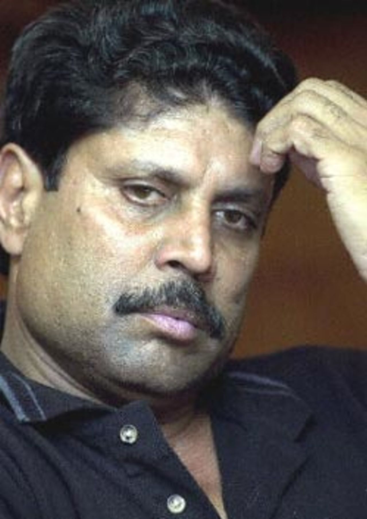 India's national cricket team coach Kapil Dev gestures during a function at a New Delhi hotel, 26 April 2000. Dev, who had earlier suggested that all of India's international matches be cancelled until allegations of match fixing had been investigated, will attend a meeting 27 April of Indian cricket administrators, players and Sports Minister Sukhdev Singh Dhindsa to discuss the fallout after South African skipper Hansie Cronje was sacked over bribery charges.