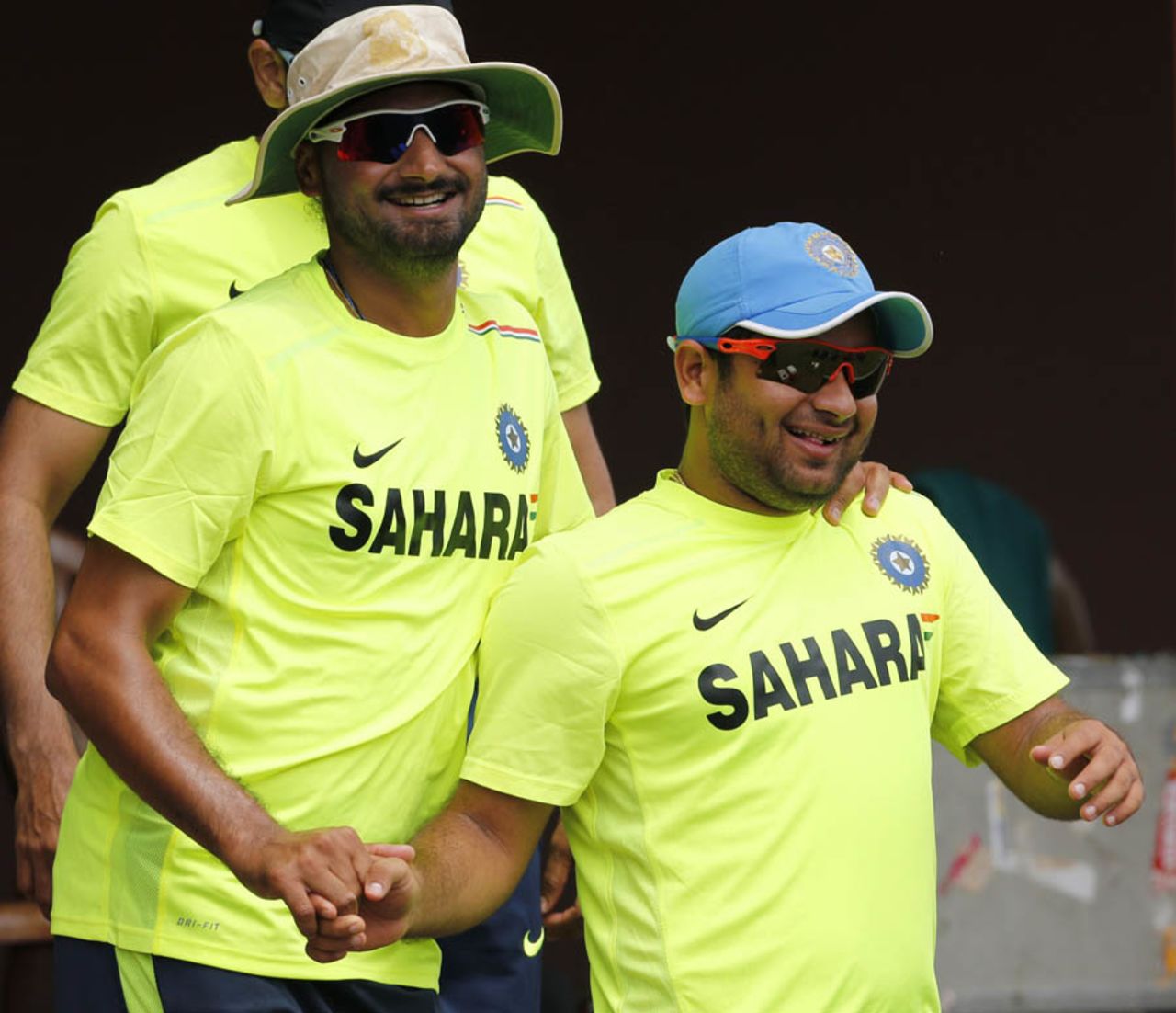 Harbhajan Singh and Piyush Chawla share a light moment at practice, Colombo, September 22, 2012