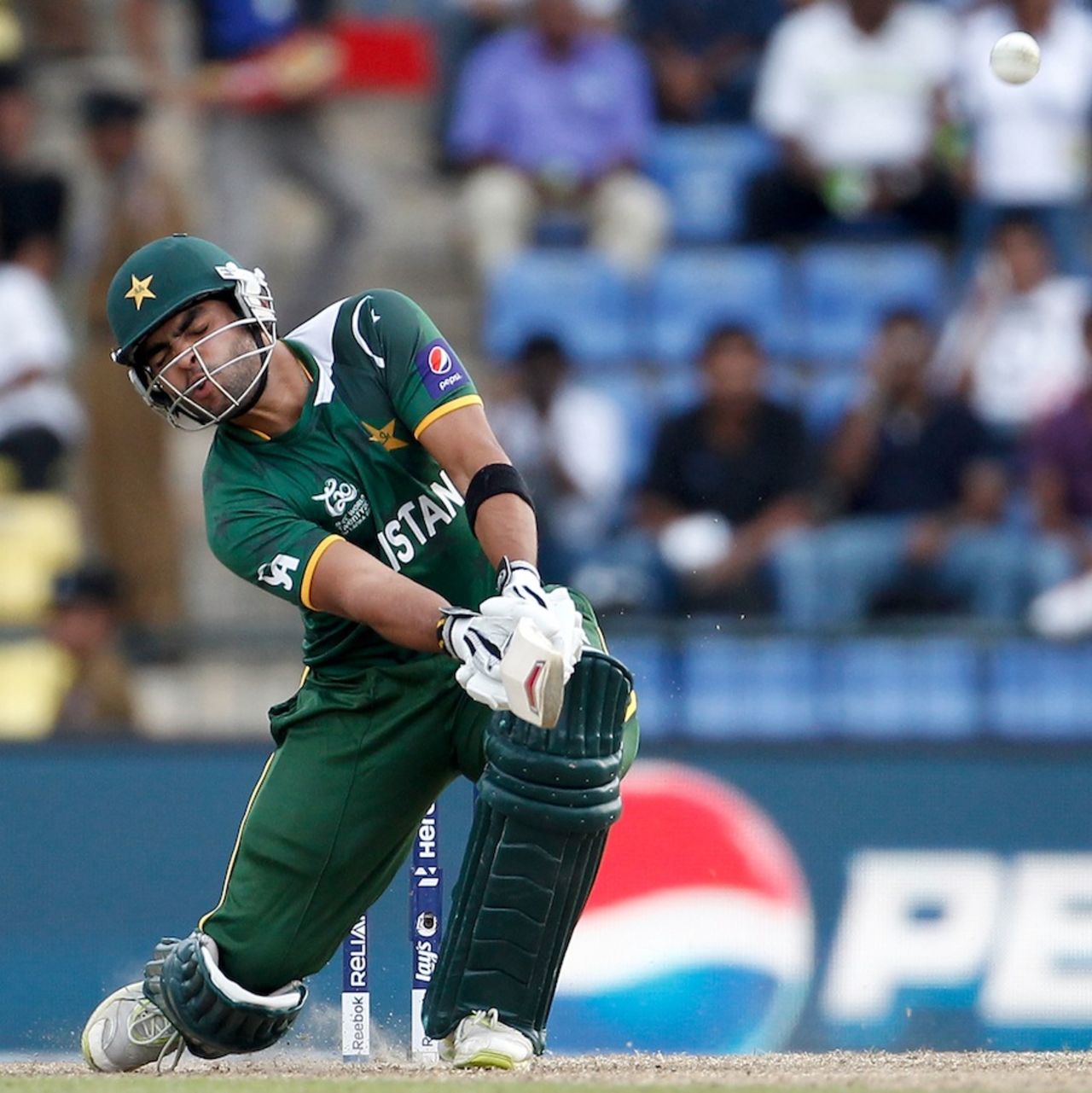 Umar Akmal takes his eyes off the ball while playing a scoop, New Zealand v Pakistan, World T20 2012, Group D, Pallekele, September, 23, 2012