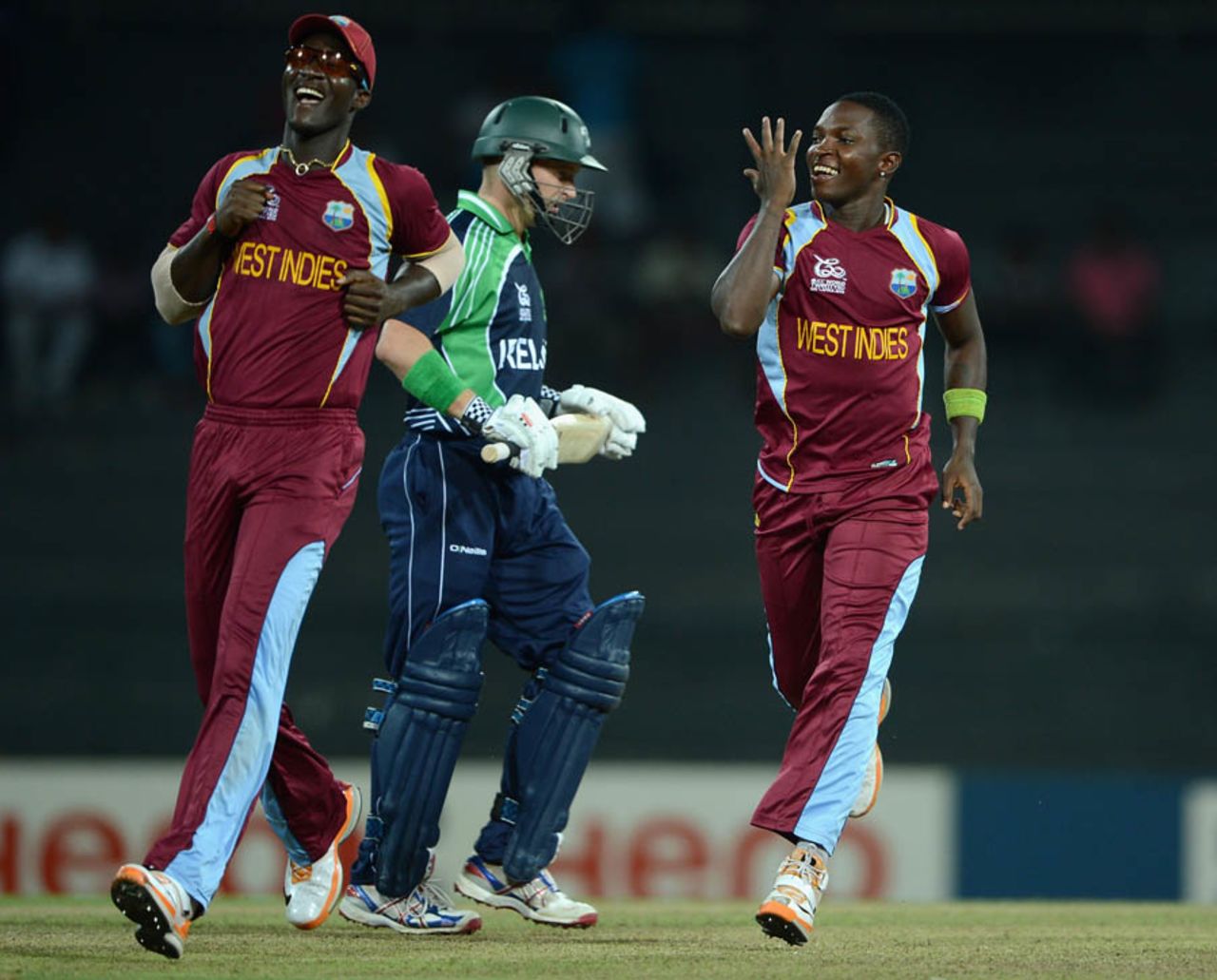 Fidel Edwards and Darren Sammy celebrate after William Porterfield's wicket, Ireland v West Indies, World Twenty20 2012, Group B, Colombo, September 24, 2012