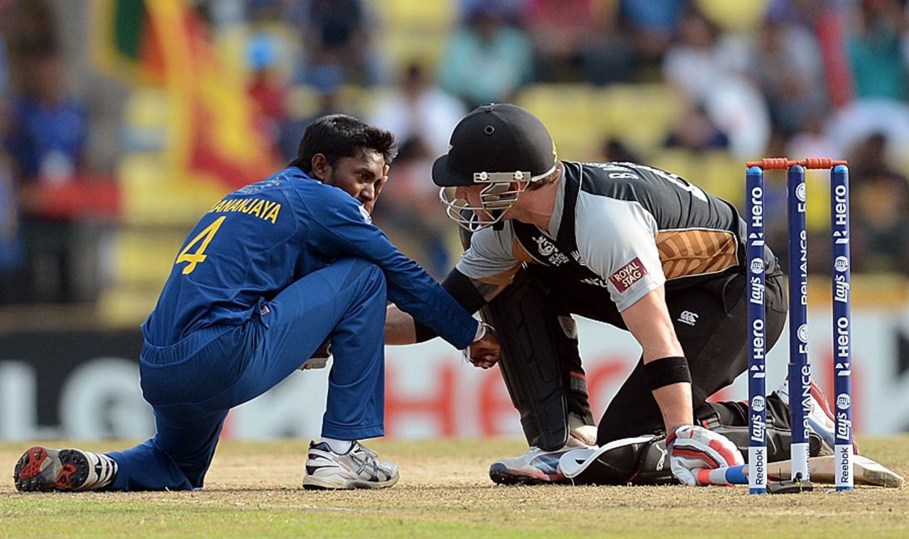 A concerned Brendon McCullum checks on Akila Dananjaya who was hit on the face, Sri Lanka v New Zealand, World T20 2012, Super Eights, Pallekele, September 27, 2012