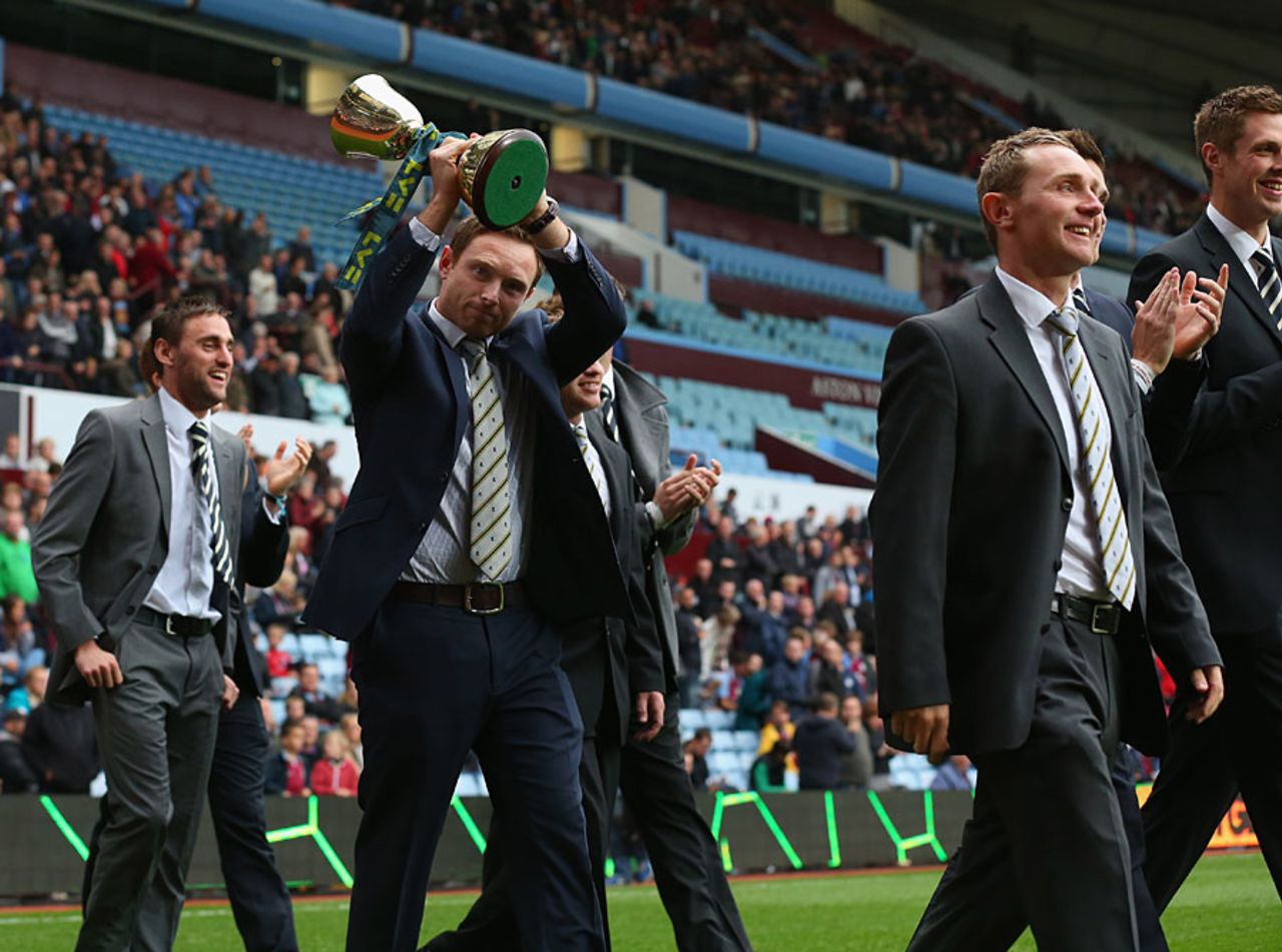 Ian Bell and his Warwickshire team-mates parade the Championship trophy around Villa Park, September 30, 2012