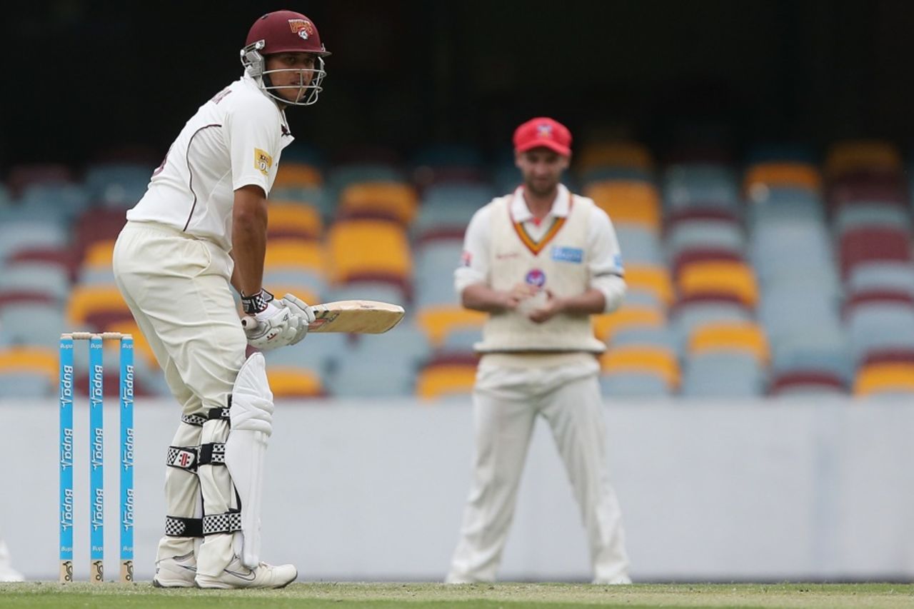 Usman Khawaja faces up while Phillip Hughes watches from slip, Queensland v South Australia, Sheffield Shield, Brisbane, day one, October 1, 2012