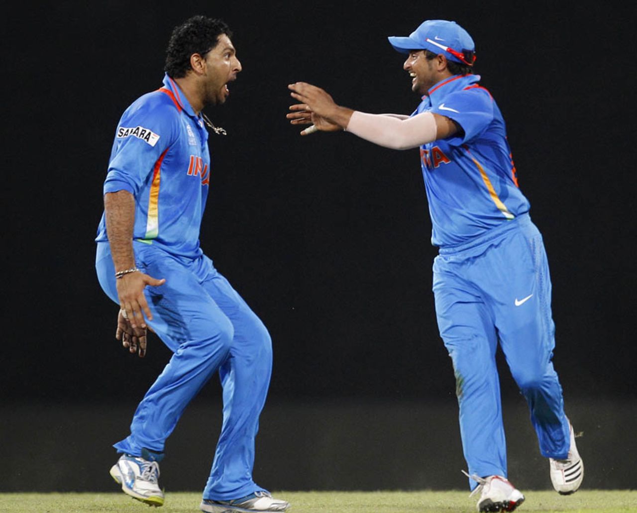 Yuvraj Singh and Suresh Raina celebrate AB de Villiers' wicket, India v South Africa, Super Eights, World Twenty20, Colombo, October 2, 2012