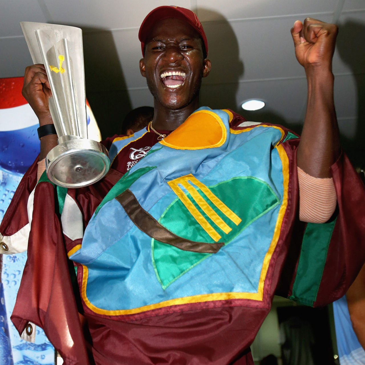Darren Sammy with the West Indies flag and the trophy after winning the World Twenty20 title, Colombo, October 7, 2012