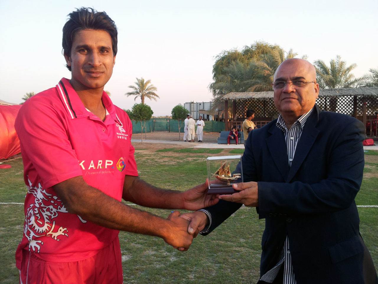 Tanwir Afzal receives his Man of the Match award for his brilliant century in the 5th place play-off match at the ACC Trophy Elite 2012 against Oman played at Al Dhaid Cricket Village