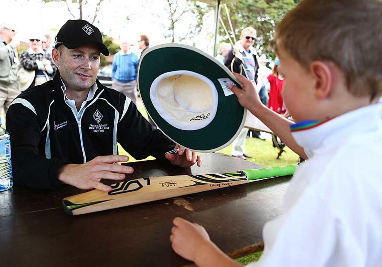 Michael Clarke signs an autograph for a young fan in Sydney, Sydney, October 13, 2012