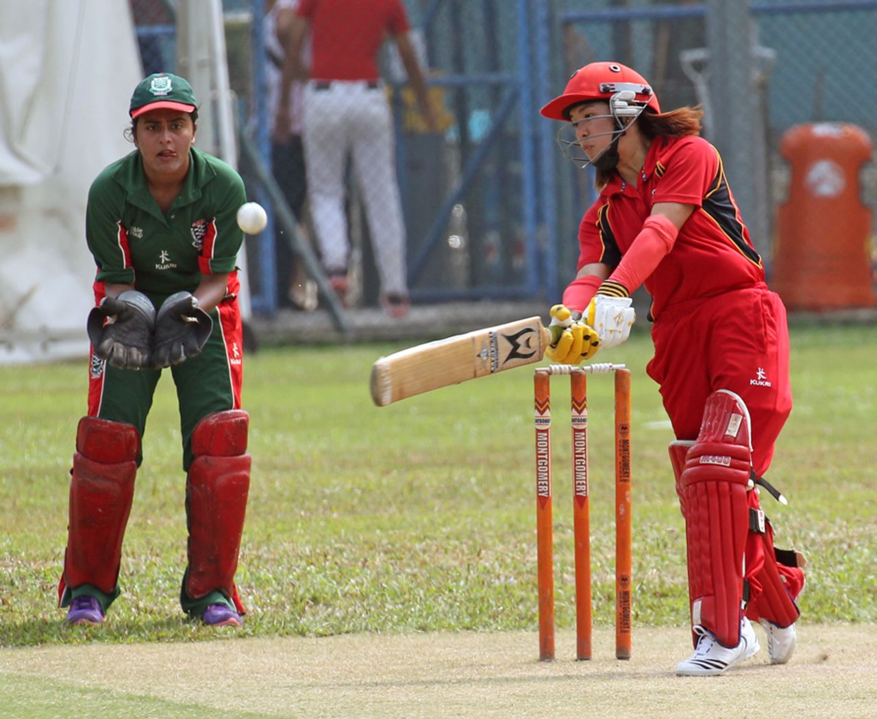 Natural Yip and Reenu Gill in action during the 3rd/4th play-off match in the Women's T20 match at Mission Road on 14th October 2012