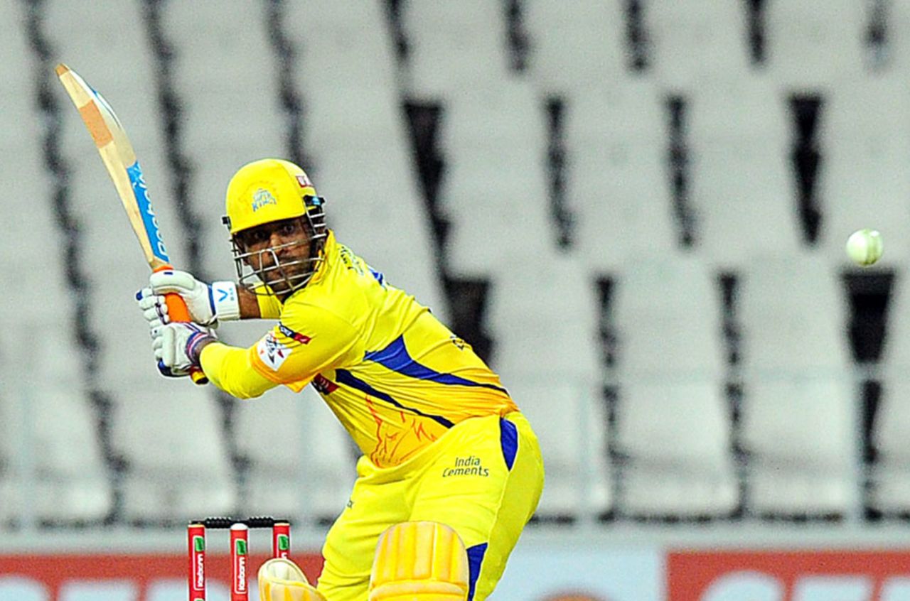 MS Dhoni winds up for a big hit, Chennai Super Kings v Mumbai Indians, Group B, Champions League T20, October 20, 2012 