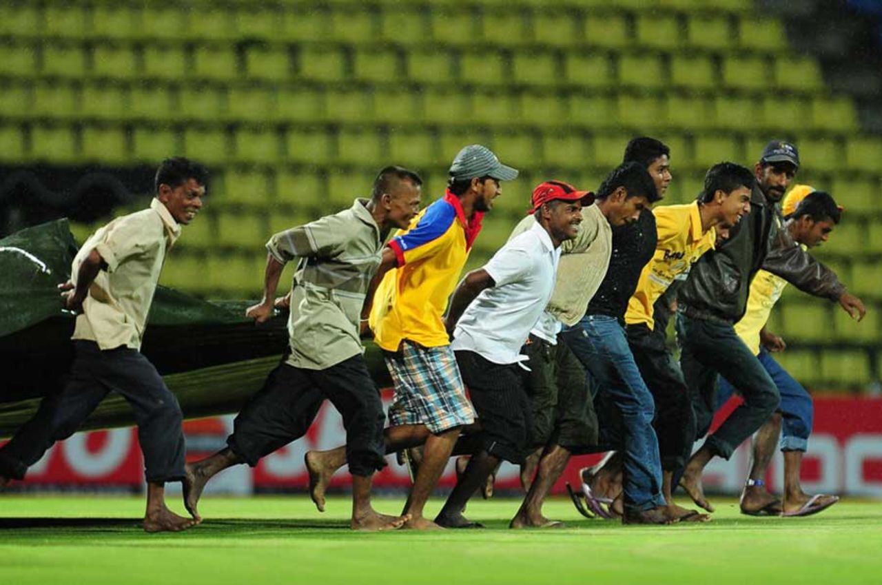 The groundstaff bring the covers on, Sri Lanka v New Zealand, Twenty20 international, Pallekele, October 30, 2012