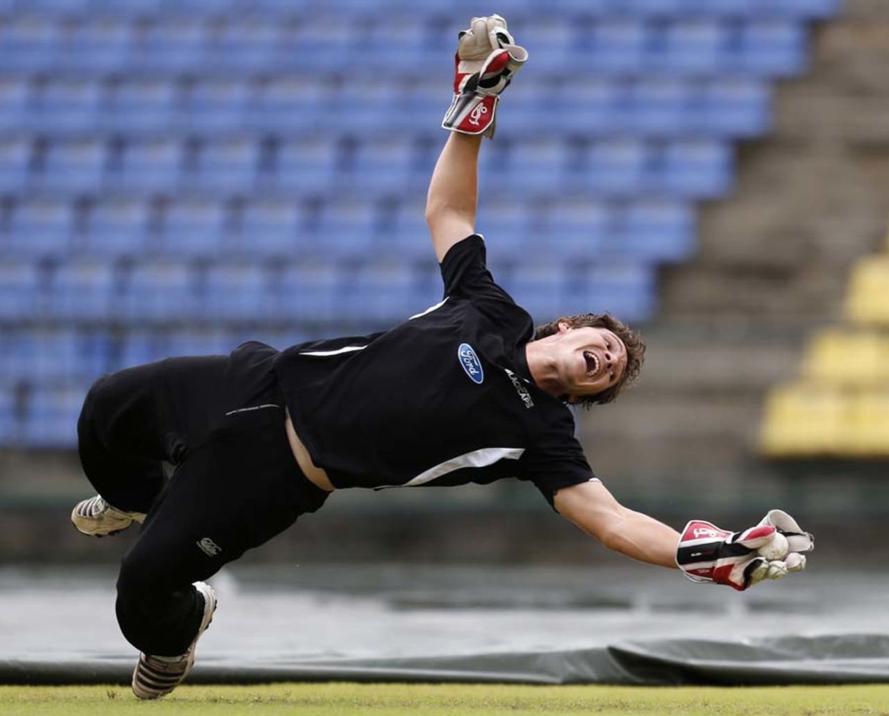 BJ Watling dives to take a catch during practice, Pellekele, October 31, 2012